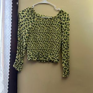 I am selling a yellow floral crop top. As well as one in black.